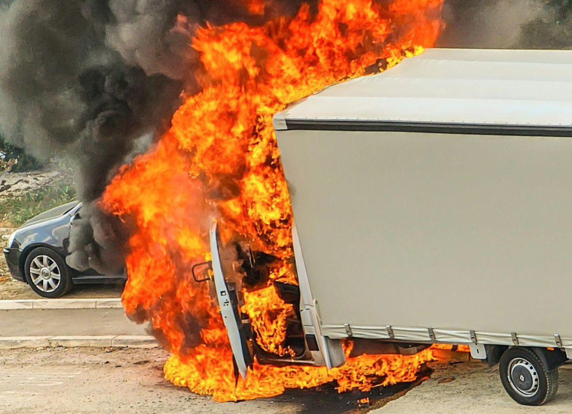 Truck accident with car, truck is burning; image by Aleksandar Rasic, via Pexels.com.